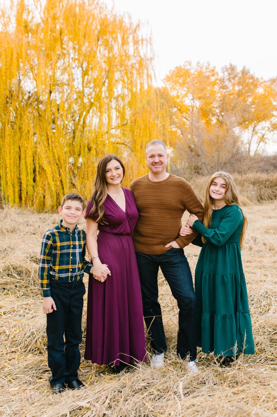 Tiffany with her family in a golden autumn field